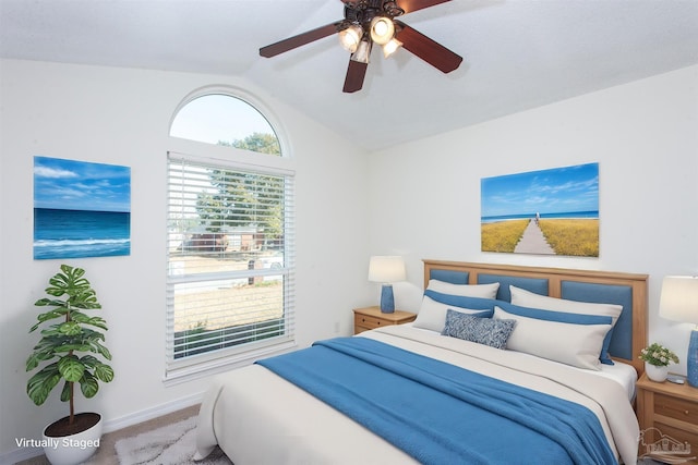 bedroom featuring ceiling fan, lofted ceiling, and carpet flooring