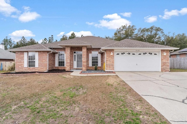 ranch-style home featuring a garage and a front yard