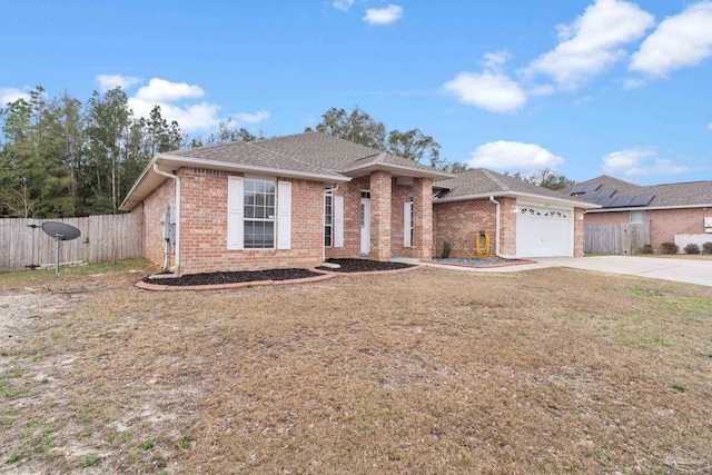 single story home with a garage and a front lawn