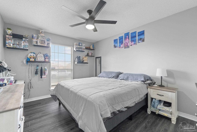 bedroom featuring ceiling fan, dark hardwood / wood-style floors, and a textured ceiling