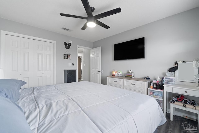 bedroom featuring hardwood / wood-style flooring, ceiling fan, and a closet