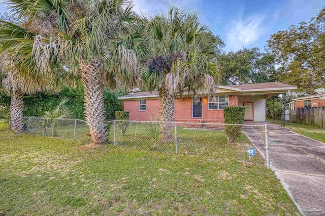 view of front of home with a front yard and a carport