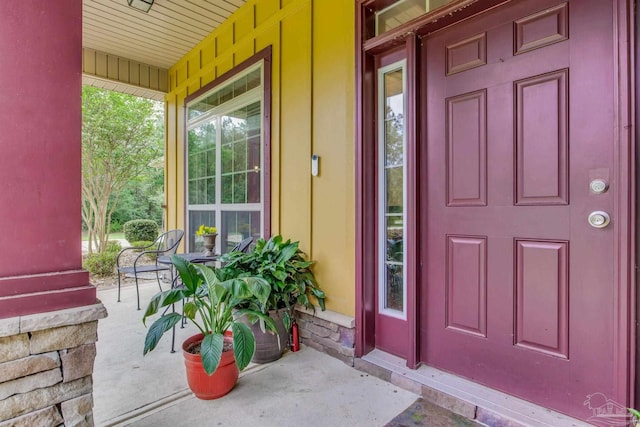 doorway to property featuring covered porch