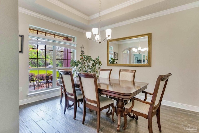 dining area featuring baseboards, a wealth of natural light, and a notable chandelier