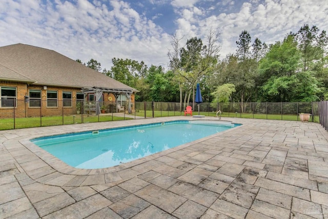 view of swimming pool with a fenced in pool, fence, a pergola, a patio area, and a lawn