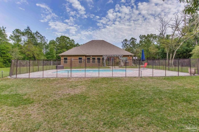 view of pool featuring fence, a yard, and a fenced in pool
