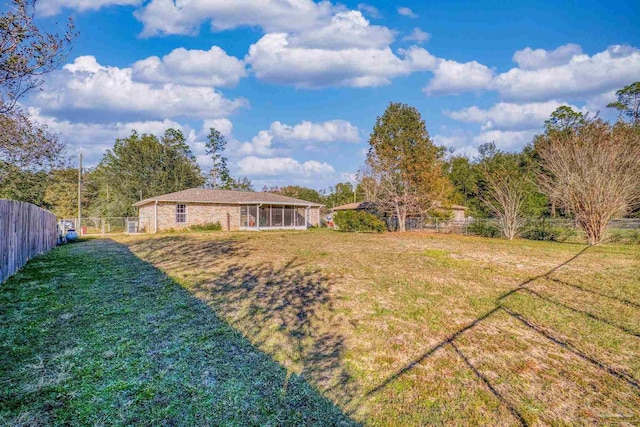 view of yard with a sunroom