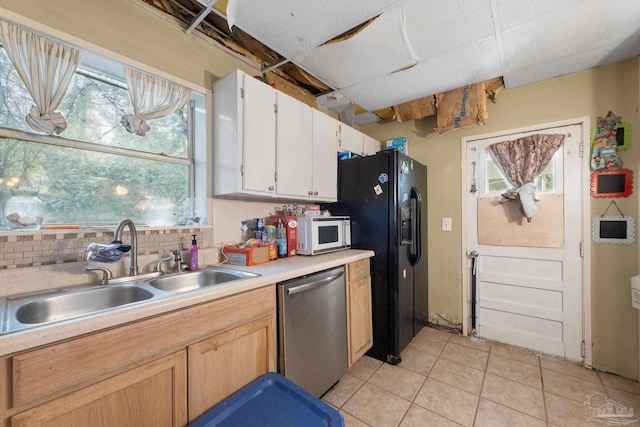 kitchen with white cabinets, backsplash, black fridge with ice dispenser, dishwasher, and sink