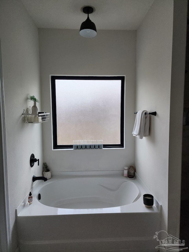 bathroom featuring a garden tub