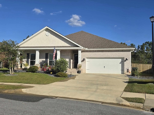 craftsman-style home featuring a garage, brick siding, concrete driveway, and fence