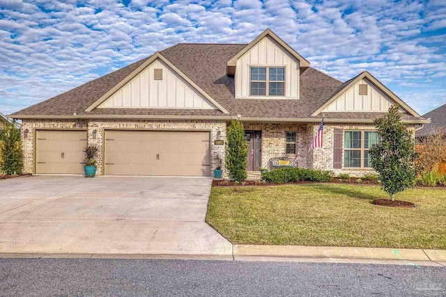 craftsman-style home featuring brick siding, an attached garage, board and batten siding, a front yard, and driveway