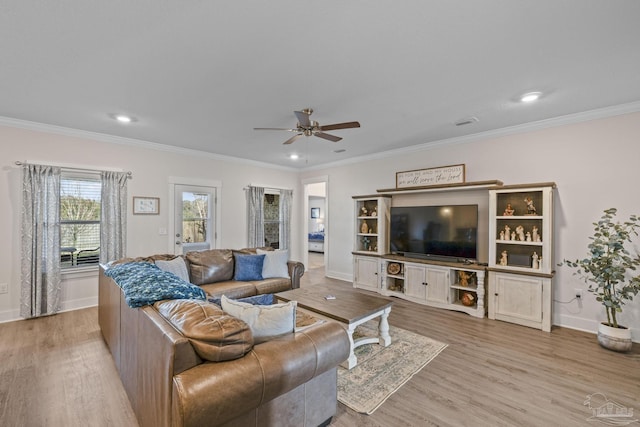 living room featuring recessed lighting, ornamental molding, a ceiling fan, wood finished floors, and baseboards