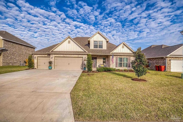 craftsman-style house with a garage, driveway, a front lawn, and brick siding