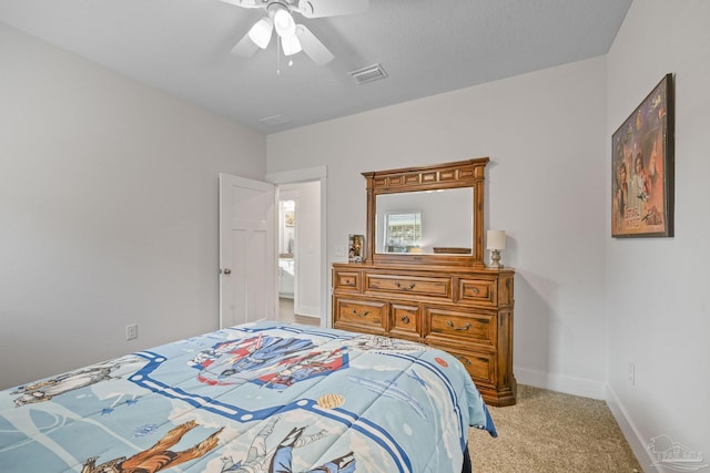 bedroom with baseboards, a ceiling fan, visible vents, and light colored carpet