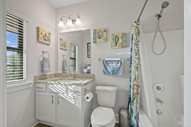 full bathroom featuring shower / tub combo, vanity, and toilet