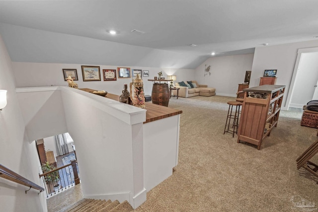 living room featuring lofted ceiling, recessed lighting, carpet flooring, and baseboards