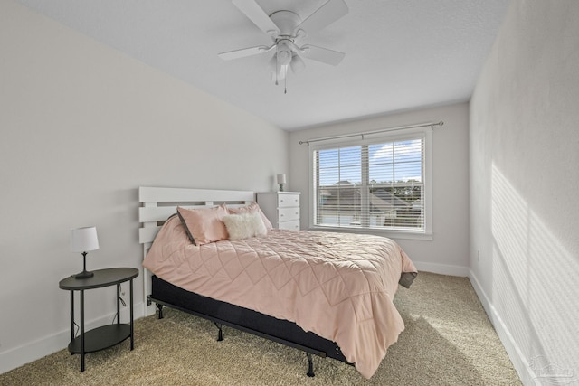 bedroom featuring a ceiling fan, carpet, and baseboards