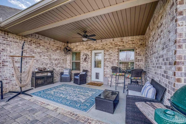 view of patio featuring an outdoor hangout area and a ceiling fan