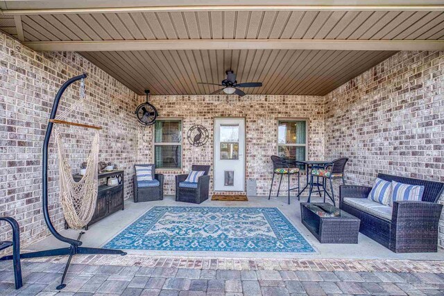 view of patio with a ceiling fan and an outdoor hangout area