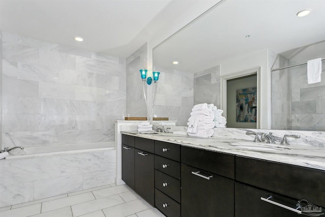 bathroom featuring vanity, plus walk in shower, and tile walls