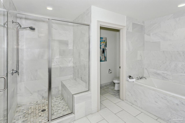 bathroom featuring tile patterned floors, independent shower and bath, and toilet