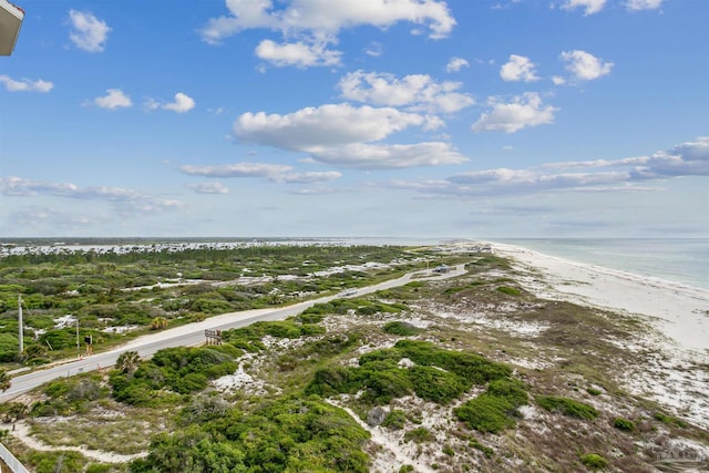 birds eye view of property with a view of the beach and a water view