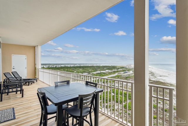 balcony with a view of the beach and a water view