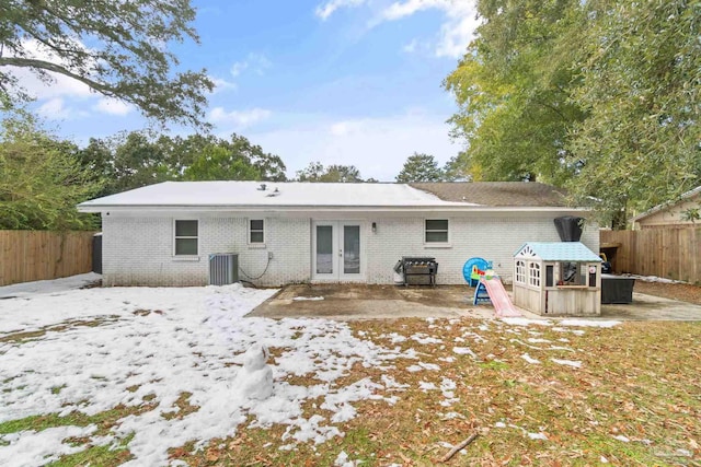 rear view of property featuring central AC