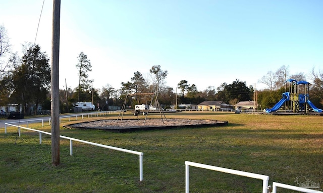 surrounding community with a lawn and a playground