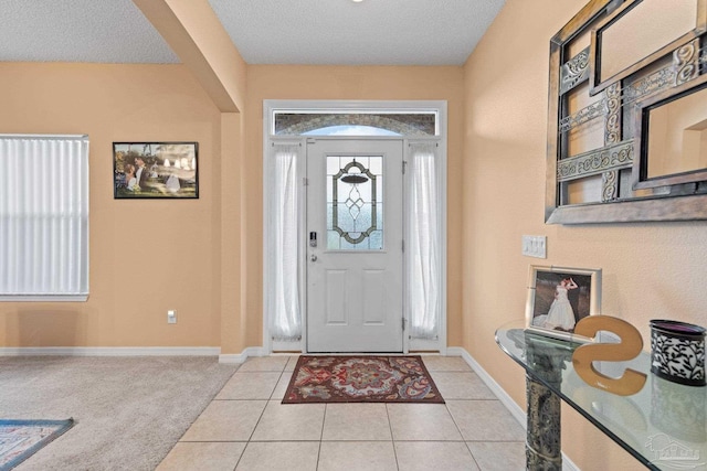 10108 Castleberry Blvd, Pensacola, FL 32526 - foyer entrance featuring a textured ceiling and light tile patterned floors