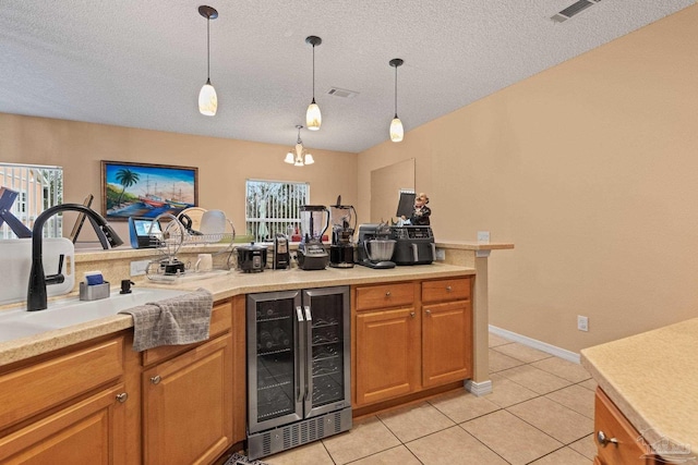 10108 Castleberry Blvd, Pensacola, FL 32526 - indoor bar featuring beverage cooler, light tile patterned floors, plenty of natural light, decorative light fixtures, and a textured ceiling