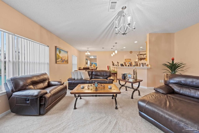 10108 Castleberry Blvd, Pensacola, FL 32526 - carpeted living room featuring a chandelier and a textured ceiling