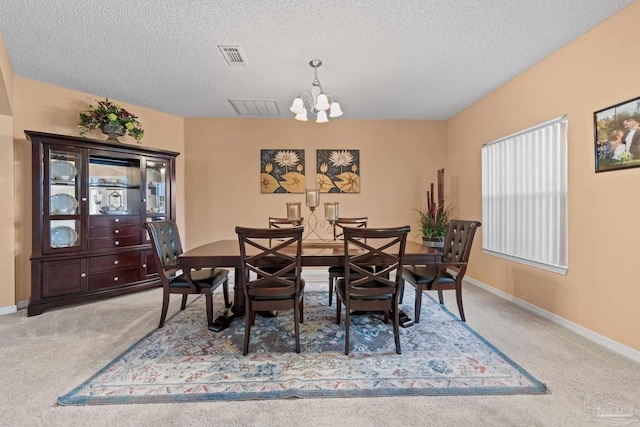 10108 Castleberry Blvd, Pensacola, FL 32526 - dining space with a chandelier, carpet, and a textured ceiling