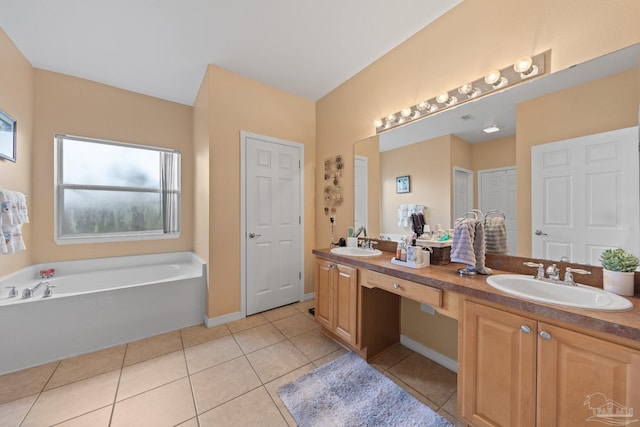 10108 Castleberry Blvd, Pensacola, FL 32526 - bathroom with double vanity, a garden tub, and tile patterned flooring