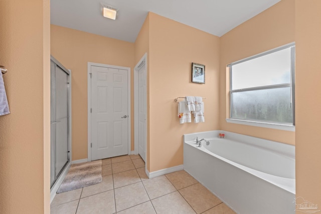 10108 Castleberry Blvd, Pensacola, FL 32526 - bathroom featuring a bath, tile patterned floors, and a shower stall