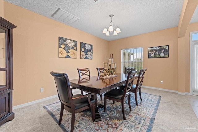10108 Castleberry Blvd, Pensacola, FL 32526 - dining space featuring a chandelier, a textured ceiling, and light colored carpet