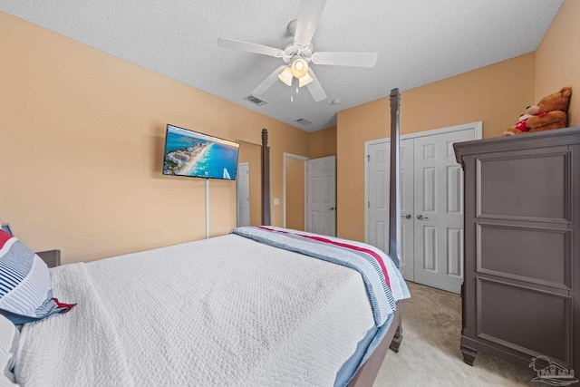 10108 Castleberry Blvd, Pensacola, FL 32526 - bedroom featuring light carpet, a closet, ceiling fan, and a textured ceiling