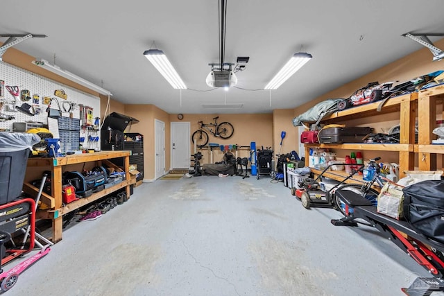 10108 Castleberry Blvd, Pensacola, FL 32526 - garage featuring a workshop area and a garage door opener