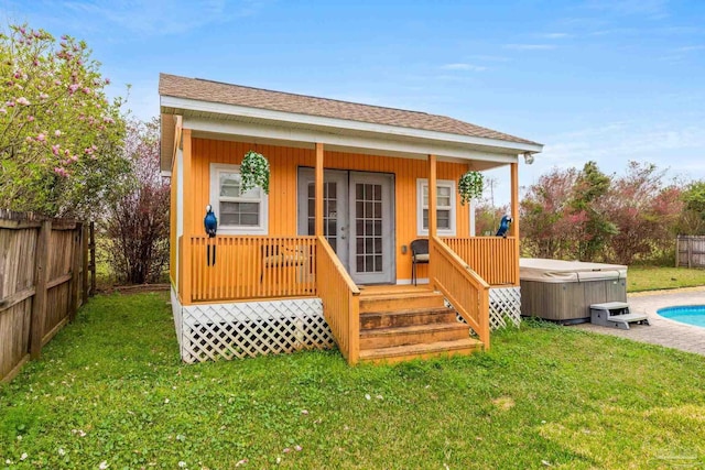 10108 Castleberry Blvd, Pensacola, FL 32526 - rear view of house featuring a hot tub and a shingled roof