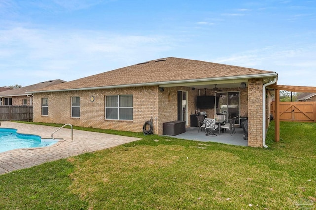 10108 Castleberry Blvd, Pensacola, FL 32526 - rear view of property featuring a patio, a fenced backyard, brick siding, and roof with shingles