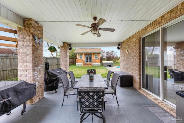 10108 Castleberry Blvd, Pensacola, FL 32526 - fenced backyard with outdoor dining space, a patio, a ceiling fan, and a grill