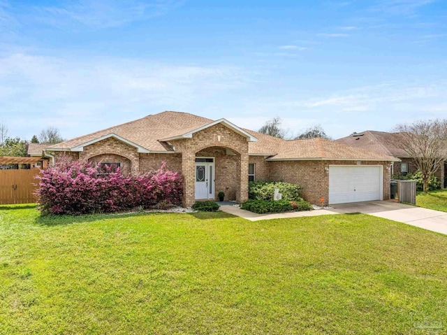 10108 Castleberry Blvd, Pensacola, FL 32526 - view of front facade with brick siding, a garage, driveway, and roof with shingles