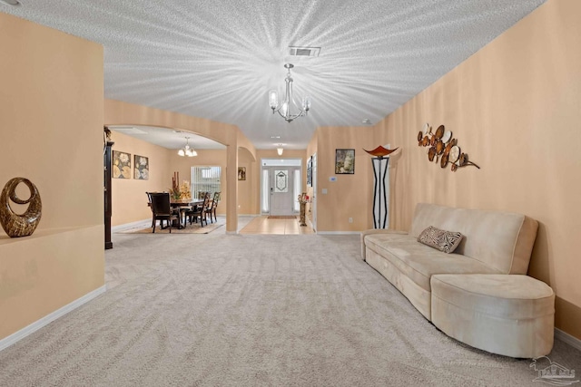 10108 Castleberry Blvd, Pensacola, FL 32526 - living area with arched walkways, a chandelier, and carpet flooring
