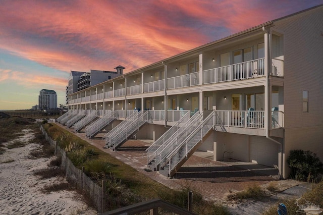 view of outdoor building at dusk