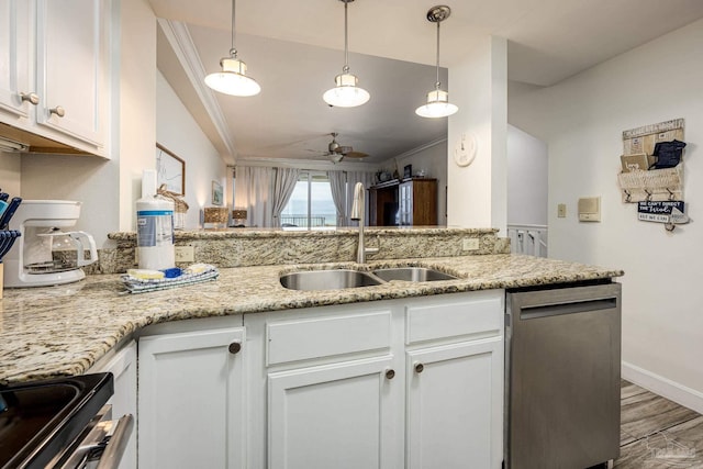 kitchen with white cabinetry, stainless steel dishwasher, ceiling fan, and crown molding