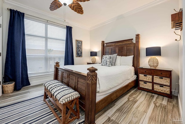 bedroom with ceiling fan, ornamental molding, and light hardwood / wood-style flooring