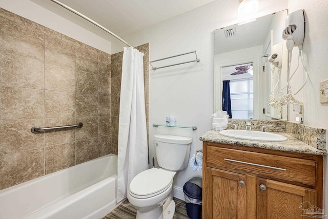 full bathroom with hardwood / wood-style floors, vanity, toilet, and shower / bathtub combination with curtain