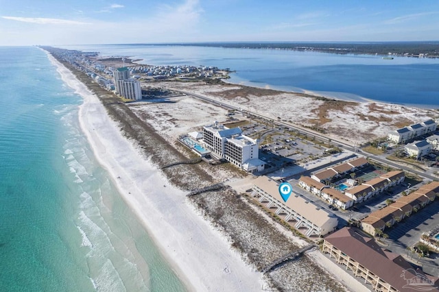 birds eye view of property featuring a water view and a view of the beach