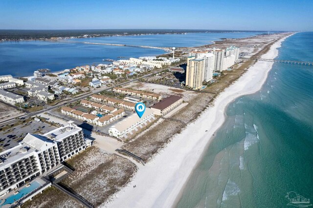 drone / aerial view featuring a water view and a beach view