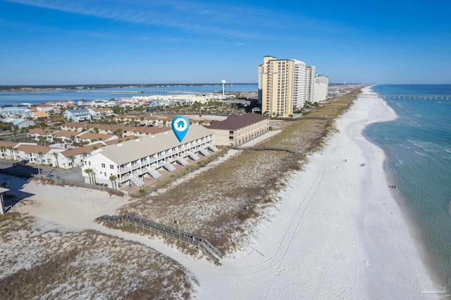 bird's eye view with a water view and a beach view